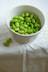 Edamame beans on bowl on a table