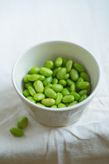 Edamame beans on bowl on a table