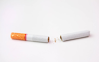 World No Tobacco Day; Broken cigarette isolated on white background. Cigarette destruction concept.