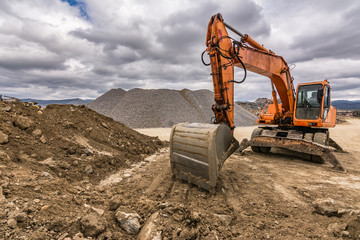 Excavator in a quarry extracting stone © Enrique del Barrio