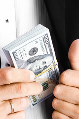 Business man holding money on white background