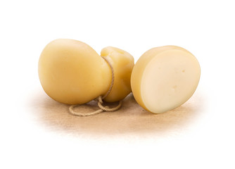Scamorza, Italian cheese, one and a half, on wooden surface