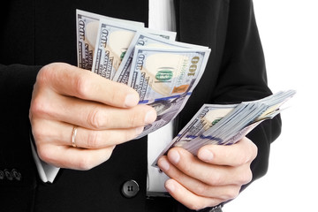 Business man holding money on white background