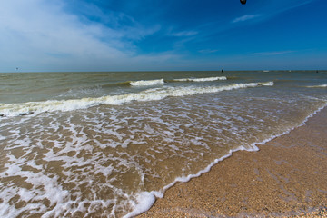 sea white wave on the sand hall. blue sea and sky