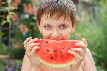 Summer food. cheerful child eating juicy watermelon. Healthy eating seasonal berries and fruits. kids emotions. Selective focus