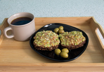 Coffee and sandwich with guacamole