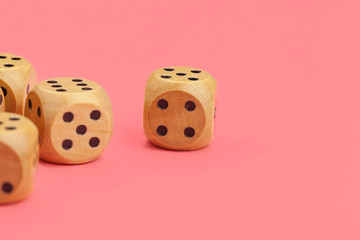 Gaming dice on pink background. Concept for games.
