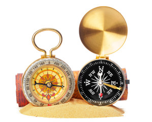 compass on the sea sand and place for text