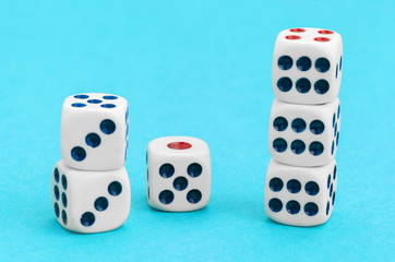 Gaming dices on blue background. Game concept.