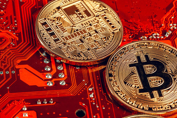 golden bitcoin and computer chip in background