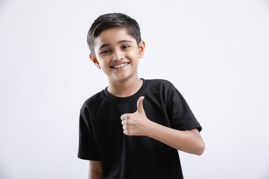 little Indian / Asian boy showing thumbs up