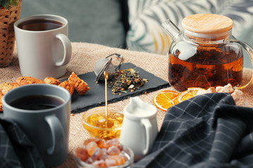 Chinese tea teapot lemon ginger honey on light tablecloth. Tea ceremony