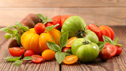 different sort of tomatoes with basil
