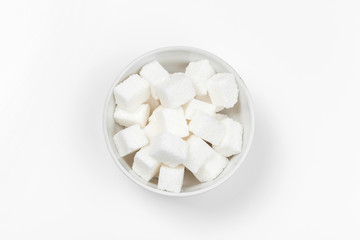 Fototapeta na wymiar Group of refined white sugar cubes close up