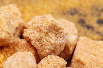 Brown cane sugar cubes isolated on white background