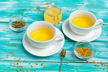 healthy herbal tea over blue background