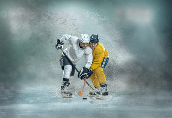 Caucassian ice hockey Players in dynamic action in a professiona