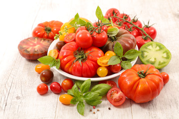 Fototapeta na wymiar mixed colorful tomato and basil
