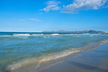 Ocean small waves in Playa de Muro Beach, Mallorca, Balearic Islands, Spain