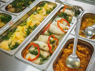 Cuisine cafeteria buffet with food. Self-service food display showcase