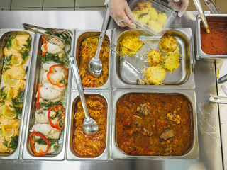 Cuisine cafeteria buffet with food. Self-service food display showcase