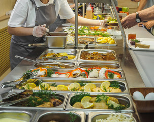 Cuisine cafeteria buffet with food. Self-service food display showcase - obrazy, fototapety, plakaty