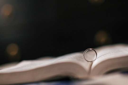 Wedding ring lies in the expanded Bible