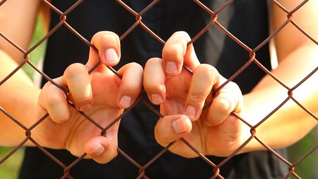 Man holding the fence, Chiangmai Thailand