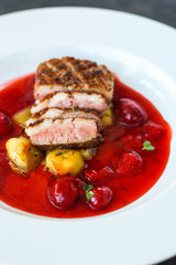 duck breast and berry sauce (meat roasting - main dish) snack. food background. top