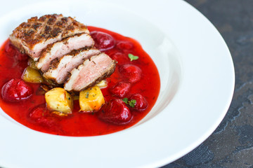 duck breast and berry sauce (meat roasting - main dish) snack. food background. top