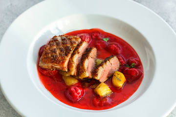 duck breast and berry sauce (meat roasting - main dish) snack. food background. top
