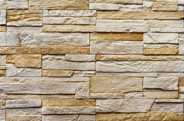 Texture of the stone wall. Panel of stones for finishing the facade of the building and interior design of the house. Background for design and decoration.