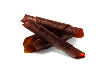 Group of fruit leather rolls isolated on white background