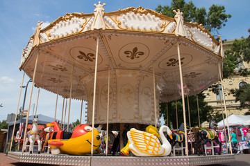 Carousel toy with horses in amusement park for children 