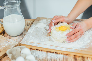 Focus at the dough in female hands! Cooking time! Bakery!