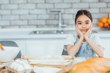 Beautiful  small girl  cooking in kitchen!