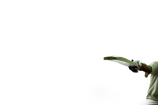 Batsman acknowledged crowd after scoring big runs against white background.