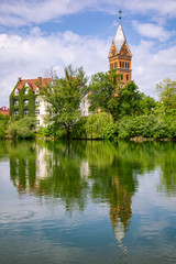 Christ Church reflecting in Isar river Landshut Old Town Bavaria Germany