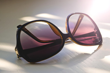 Sunglasses with a retro vintage lenses on the table