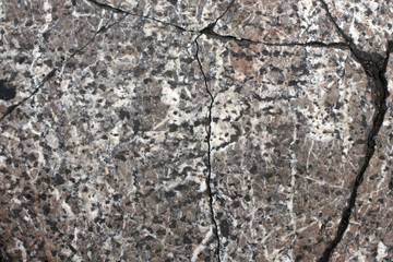 texture of old stone slab with cracks. shades of grey