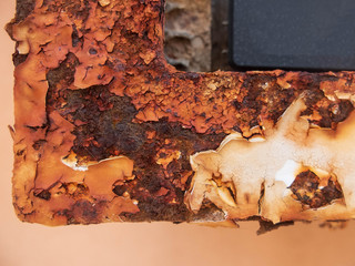 Rusty surface of metallic element with peeling paint