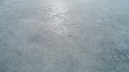 ice surface on the water in the spring with traces of fishermen and people