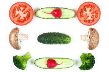 Ingredients for homemade pizza on white background. Top view. Ingredients for salad, slices mushrooms, slices tomatoes, cucumbers and broccoli. Healthy food conception