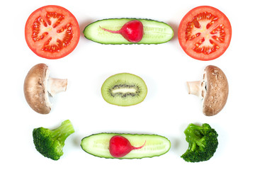 Ingredients for homemade pizza on white background. Top view. Ingredients for salad, slices mushrooms, slices tomatoes, cucumbers, broccoli and kiwi . Healthy food conception