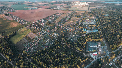 village with roads and forest, view from the drone