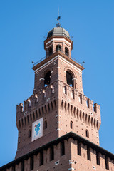 Milan, Italy: the biscione, an azure serpent in the act of consuming a human, the emblem of the House of Visconti and of the city from the 11th century, on the Filarete Tower of the Sforza Castle