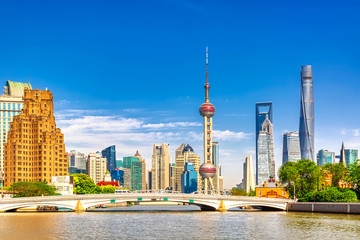 Shanghai pudong skyline with historical Waibaidu bridge, China during summer sunny day