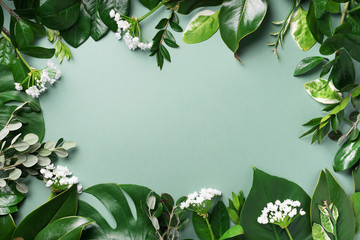 Creative layout made of tropical green leaves. Flat lay. Top view. Summer or spring nature concept....