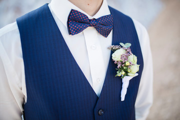Boutonniere from roses to vest