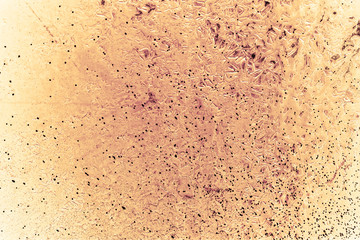 Vintage yellow background. Rough painted wall of aspen gold color. Imperfect plane of golden colored. Uneven old decorative toned backdrop of yellow tint. Texture of gold hue. Ornamental stony surface